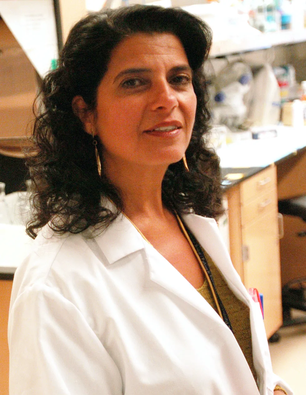 (Cambridge, MA - Friday, July 29, 2005) Marsha Moses, Associate Professor of Surgery, shows samples of urine tests that are used to detect breast cancer inside her lab at Children's Hospital in Boston. Staff Photo: Kris Snibbe/Harvard News Office
